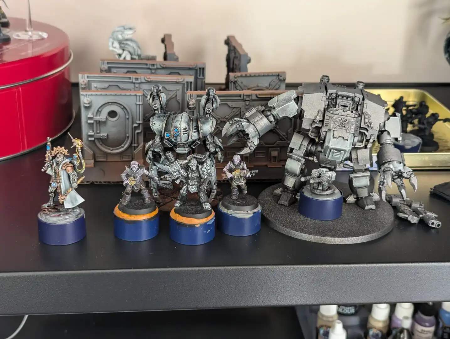 A photograph of partially painted Warhammer 40k miniatures.